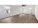 Bright living room features wood-look floors and a ceiling fan at 464 Rockborough Ter, Stone Mountain, GA 30083