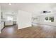 Bright and airy living room with hardwood floors, lots of natural light, and a view into the kitchen at 464 Rockborough Ter, Stone Mountain, GA 30083
