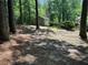 Backyard of home with outbuilding shed and tree coverage at 2105 Windy Oak Ct, Lithia Springs, GA 30122
