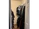 Walk-in closet with clothes hanging on a rod at 2105 Windy Oak Ct, Lithia Springs, GA 30122