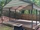 View of a wooden gazebo structure with metal roof and beams at 2105 Windy Oak Ct, Lithia Springs, GA 30122