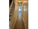 Tiled hallway with staircase, neutral walls and trim leading to additional rooms at 2105 Windy Oak Ct, Lithia Springs, GA 30122