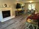 Living room with a marble fireplace, hardwood floors, and large window at 2105 Windy Oak Ct, Lithia Springs, GA 30122