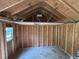 Interior view of the shed showing wood framing and a single window at 2105 Windy Oak Ct, Lithia Springs, GA 30122