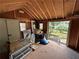 Interior view of the shed, showing a doorway and some storage items at 2105 Windy Oak Ct, Lithia Springs, GA 30122