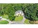 Stunning aerial view of a charming home with well-manicured lawn and a long driveway at 2709 Gentry Dr, Douglasville, GA 30135