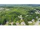 Panoramic aerial view of a property nestled in a neighborhood surrounded by dense trees at 2709 Gentry Dr, Douglasville, GA 30135