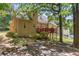 Beautiful backyard with mature trees, a deck, and landscaping at 2709 Gentry Dr, Douglasville, GA 30135