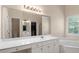 Bright bathroom with double vanities, a large mirror, and a soaking tub at 2709 Gentry Dr, Douglasville, GA 30135