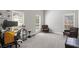 Bright bedroom with neutral walls, carpet flooring, and two comfortable armchairs at 2709 Gentry Dr, Douglasville, GA 30135