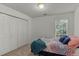 This bedroom features natural light, closet space and neutral carpet at 2709 Gentry Dr, Douglasville, GA 30135