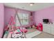 This bedroom features bright colors, natural light, and playful decorations at 2709 Gentry Dr, Douglasville, GA 30135