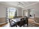 Bright dining room features a large window, wood floors, and classic decor at 2709 Gentry Dr, Douglasville, GA 30135