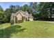 Traditional home with a stone facade and large front yard at 2709 Gentry Dr, Douglasville, GA 30135