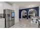 Stylish kitchen adjacent to dining area and living room, featuring stainless steel fridge at 2709 Gentry Dr, Douglasville, GA 30135