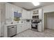 Bright and modern kitchen with stainless steel appliances and ample cabinet space at 2709 Gentry Dr, Douglasville, GA 30135