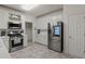 Well-lit kitchen with white cabinetry and modern stainless steel appliances at 2709 Gentry Dr, Douglasville, GA 30135