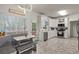 Bright kitchen with breakfast nook, white cabinetry, and stainless steel appliances at 2709 Gentry Dr, Douglasville, GA 30135