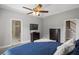 Spacious main bedroom with neutral walls, a ceiling fan, and access to the en-suite bathroom at 2709 Gentry Dr, Douglasville, GA 30135