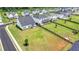 Aerial view of the house, neighborhood, and the surrounding area featuring lots of green space at 3695 Andover St, Cumming, GA 30028