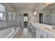 Elegant bathroom with dual sinks, marble countertops, and glass-enclosed shower at 3695 Andover St, Cumming, GA 30028