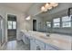Elegant bathroom with dual sinks, marble countertops, and glass-enclosed shower at 3695 Andover St, Cumming, GA 30028