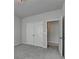 Cozy bedroom with a view into the next room, with closet doors at 3695 Andover St, Cumming, GA 30028