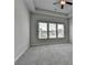 Spacious bedroom with ceiling fan and large windows letting in natural light at 3695 Andover St, Cumming, GA 30028