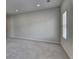 A spacious carpeted room featuring a window and neutral wall color at 3695 Andover St, Cumming, GA 30028