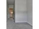 Spacious bedroom with neutral paint, plush carpeting, and access to a walk in closet at 3695 Andover St, Cumming, GA 30028