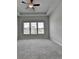 Spacious bedroom with neutral walls, ceiling fan, and large windows at 3695 Andover St, Cumming, GA 30028