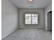 Bedroom featuring plush carpet, neutral paint, and a window with neighborhood views at 3695 Andover St, Cumming, GA 30028