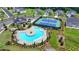 Aerial view of a community pool and tennis courts with well-manicured landscaping at 3695 Andover St, Cumming, GA 30028