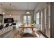 Dining room featuring contemporary chairs, natural light from windows, and an adjacent kitchen at 3695 Andover St, Cumming, GA 30028