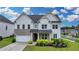 Charming two-story home with a landscaped yard, brick accents and a two car garage at 3695 Andover St, Cumming, GA 30028