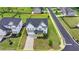 Aerial view of charming two-story home with landscaped yard and inviting curb appeal at 3695 Andover St, Cumming, GA 30028