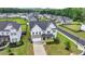 Aerial view of charming two-story home with landscaped yard and inviting curb appeal at 3695 Andover St, Cumming, GA 30028