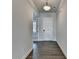 Bright hallway with gray walls and hardwood floors, offering an inviting entrance to the home at 3695 Andover St, Cumming, GA 30028