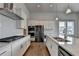 Bright kitchen featuring stainless steel appliances, quartz countertops, and white cabinetry at 3695 Andover St, Cumming, GA 30028
