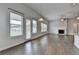 Open-concept living area with a fireplace and access to a dining nook at 3695 Andover St, Cumming, GA 30028