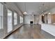 Open-concept living area with a fireplace and access to a dining nook at 3695 Andover St, Cumming, GA 30028