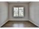 Office space with hardwood floors and a large window providing natural light at 3695 Andover St, Cumming, GA 30028