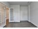 The space features hardwood floors, neutral walls, and French doors for separation and style at 3695 Andover St, Cumming, GA 30028