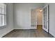 Bright office space with hardwood floors and elegant French doors leading to another room at 3695 Andover St, Cumming, GA 30028