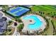 Aerial view of a community pool and tennis courts with lush landscaping at 3695 Andover St, Cumming, GA 30028