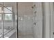 Sleek walk-in shower with large marble-style tiles and modern fixtures at 3695 Andover St, Cumming, GA 30028
