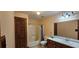 Full bathroom featuring vanity and tub/shower combo at 4055 Haralson Mill Ne Rd, Conyers, GA 30012