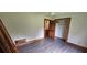 This bedroom offers wood trim, ceiling fan, closet, and durable floors at 4055 Haralson Mill Ne Rd, Conyers, GA 30012