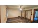 Spacious bedroom features wood-look floors, ceiling fan, and double closets with shelving at 4055 Haralson Mill Ne Rd, Conyers, GA 30012