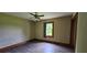 Bedroom boasts natural light, ceiling fan, wood trim and durable floors at 4055 Haralson Mill Ne Rd, Conyers, GA 30012